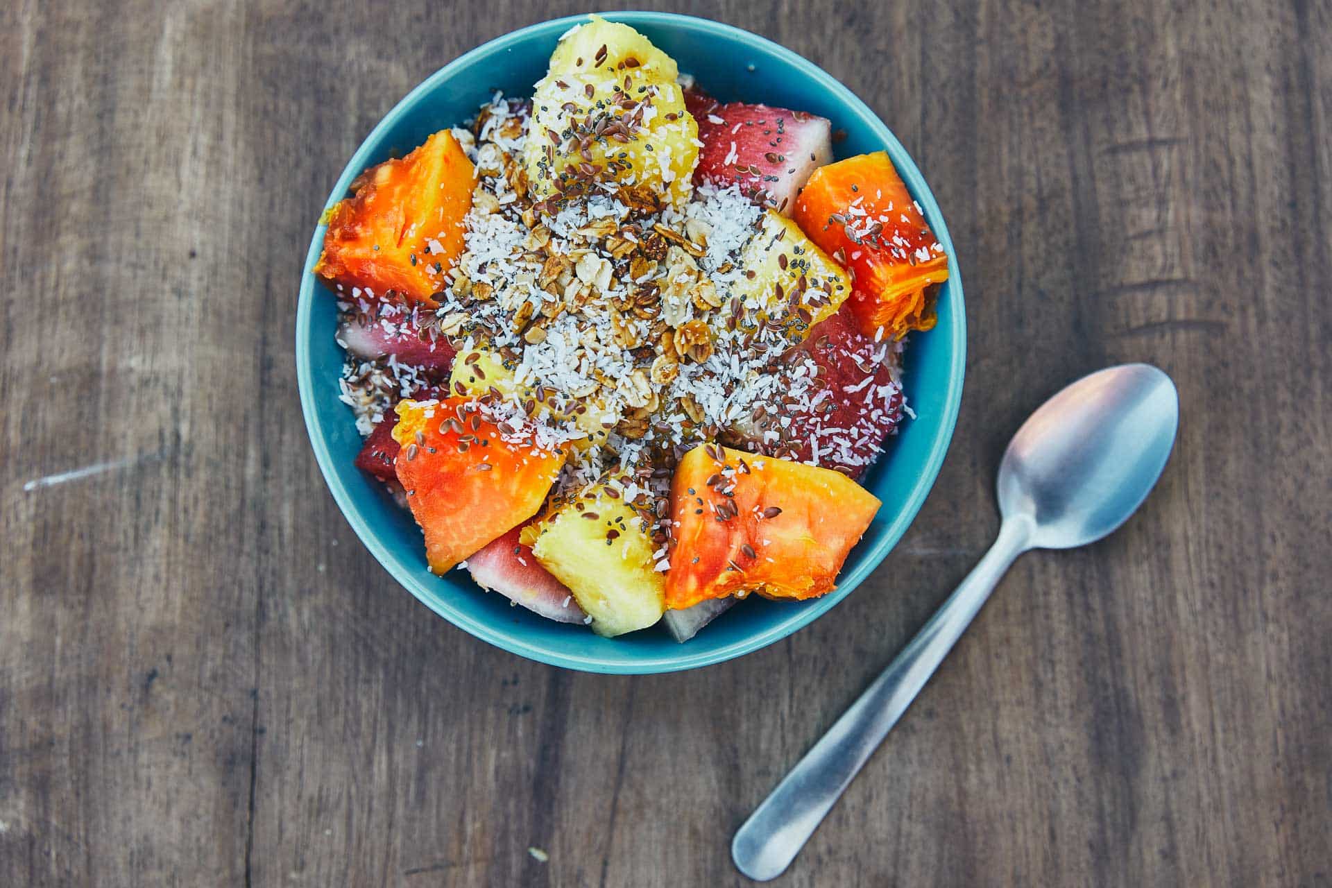 A superfood bowl with fruit and seeds