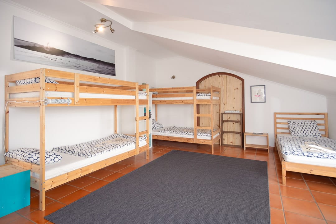 Beds and window at standard dorm ericeira rapturecamps