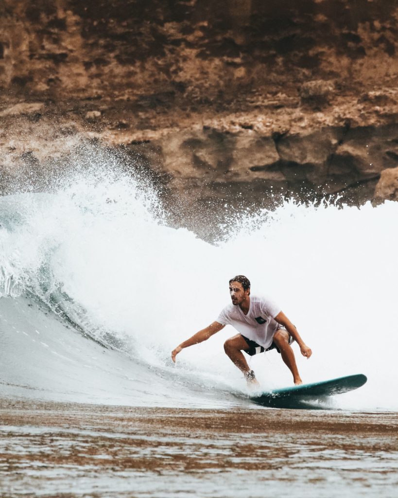 Beginner surfer riding a wave