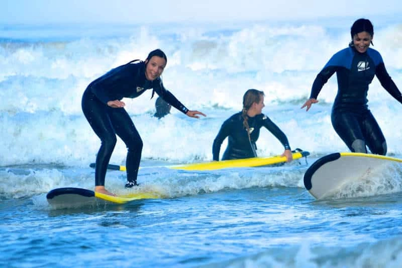 Surfers in wetsuits at Rapture's Ericiera camp