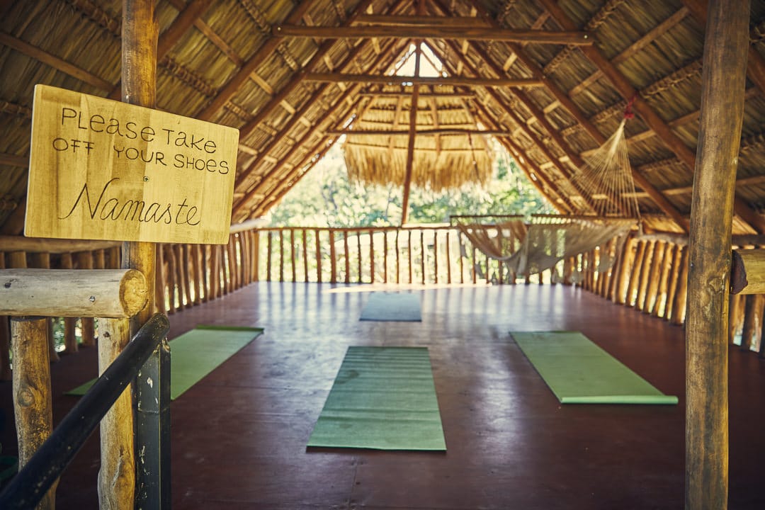A yoga deck with namaste sign
