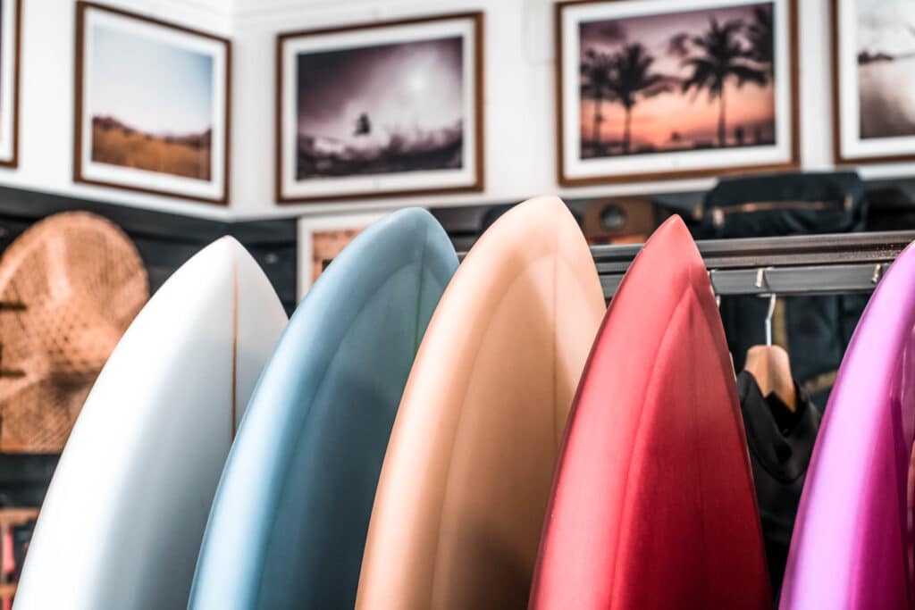 Closeup of 5 Surf Boards of Different Colors Lined up