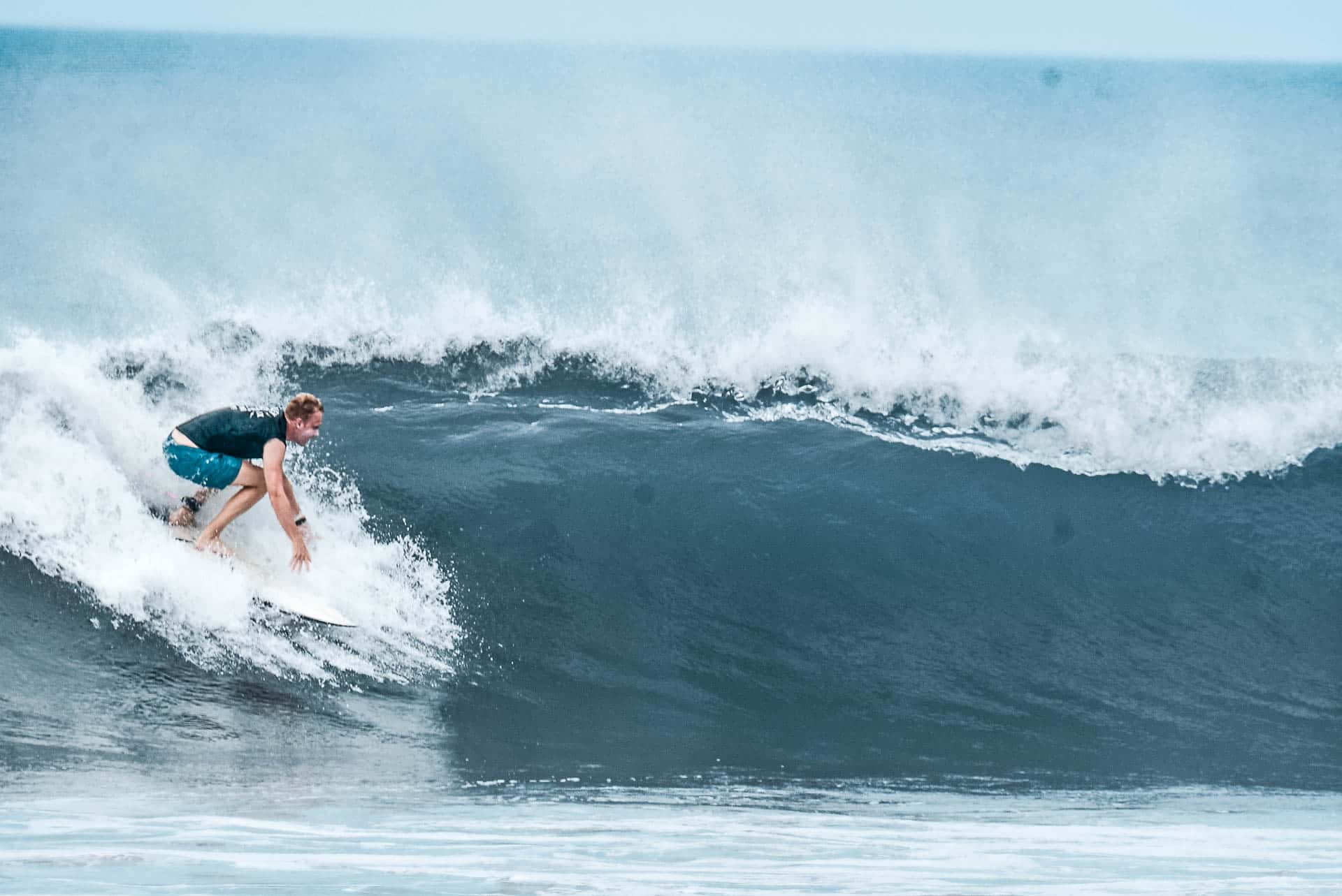 Person surfing on a wave in Costa Rica